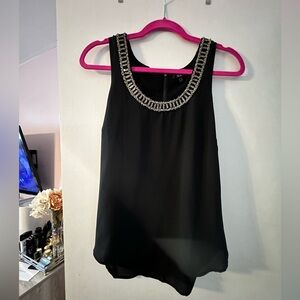 XOXO chiffon bejeweled collar tank top with a half zip back.